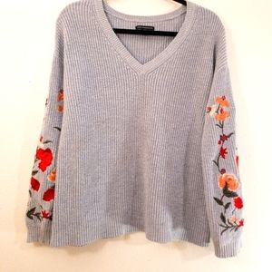 American Eagle, light blue knit vneck sweater with floral embroidery on sleeves